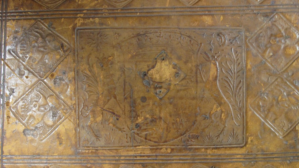 Figure 2, Auckland Libraries, Sir George Grey Special Collections, Med. MS G.132, lower cover, showing panel and stamps and indentations from medieval furnishing